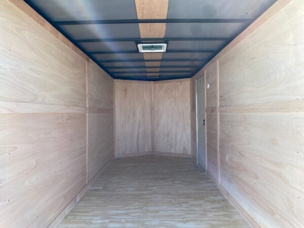 inside a 7x14 white standard enclosed cargo trailer tandem axle