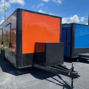 Quality Cargo 8.5x22 orange food trailer with dual concession windows, 8-foot hood, generator box, and commercial kitchen package for sale.