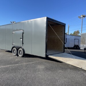 Deep South 8.5x24 charcoal enclosed car hauler trailer with polycore exterior, blackout package, escape door, mag wheels, and 7'6" interior height.