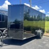 J & C Cargo 6x12 SA Enclosed Cargo Trailer for sale. Features include .080 Polycore exterior, blackout finish, 6'9" interior height, screwless design, V-nose, and rear ramp door.