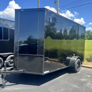 J & C Cargo 6x12 SA Enclosed Cargo Trailer for sale. Features include .080 Polycore exterior, blackout finish, 6'9" interior height, screwless design, V-nose, and rear ramp door.