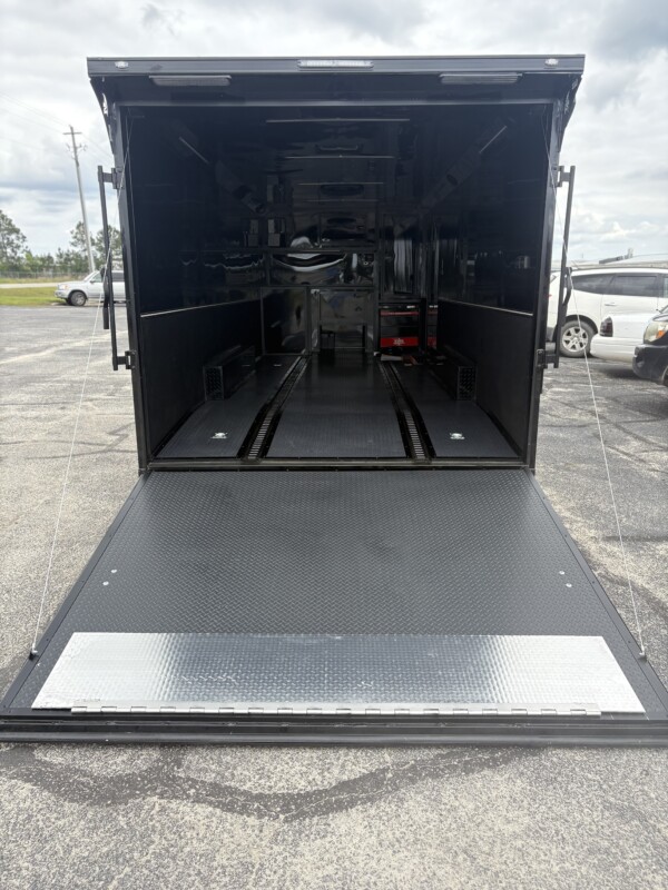 Experience premium hauling with the Spartan Cargo S8.5x24TA Race Car Trailer—fully loaded with gullwing doors, high-end features, and race-ready performance.