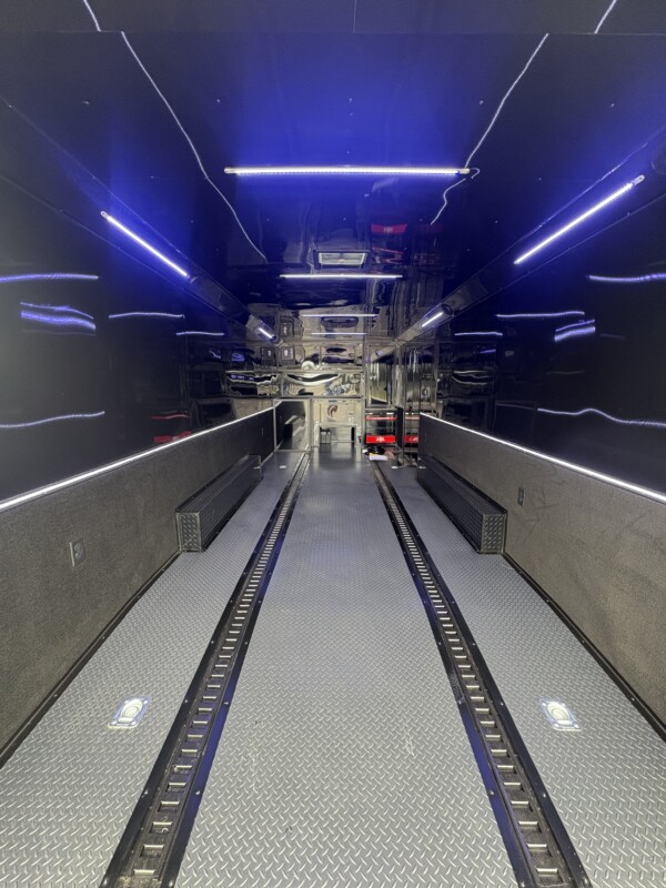 Experience premium hauling with the Spartan Cargo S8.5x24TA Race Car Trailer—fully loaded with gullwing doors, high-end features, and race-ready performance.