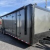 The Quality Cargo 8.5x32 TA Race Car Trailer is fully equipped with a full bathroom, sleek charcoal blackout package, and spacious interior—perfect for car haulers who demand comfort and performance.