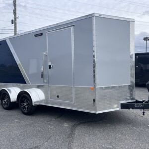 Rock Solid 7x16 tandem axle enclosed motorcycle trailer with Silver Frost and Indigo Blue exterior, RTP flooring, E-track, torsion axles, and premium upgrades.