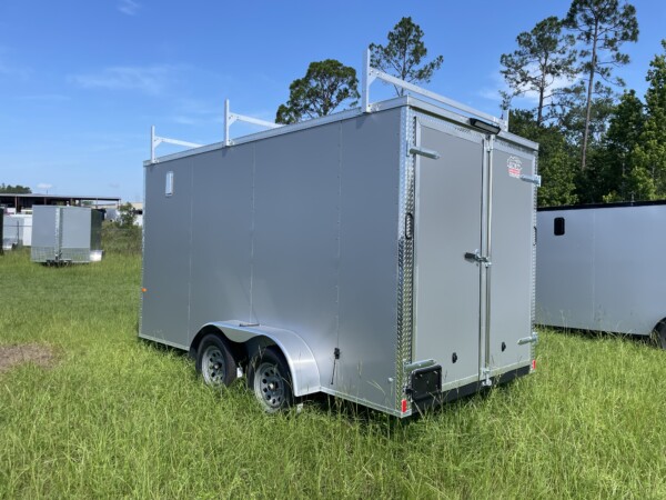 Contractor-ready 7x14 Rock Solid enclosed trailer with triple ladder rack, aluminum access ladder, Polycore skin, 7ft interior, LED flood lights, and barn doors. $6,999 – Stock #67843. Built to work as hard as you do.