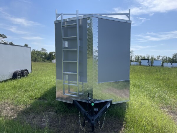 Contractor-ready 7x14 Rock Solid enclosed trailer with triple ladder rack, aluminum access ladder, Polycore skin, 7ft interior, LED flood lights, and barn doors. $6,999 – Stock #67843. Built to work as hard as you do.