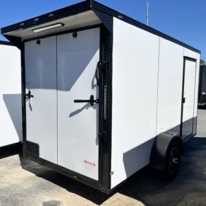 Deep South 6x12 white enclosed cargo trailer with Polycore exterior, blackout package, alloy wheels, spoiler, and ramp door.