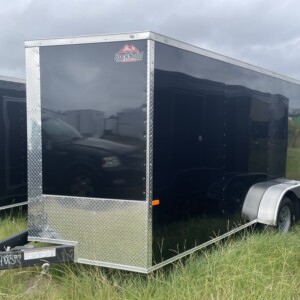 Black 7x16 tandem axle enclosed cargo trailer with .080 Polycore exterior, semi-screwless construction, V-nose design, and ramp door