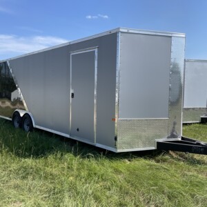 Silver Frost and Black 8.5x24 tandem axle custom enclosed trailer with Polycore exterior, torsion axles, rear spoiler, D-rings, and ramp door