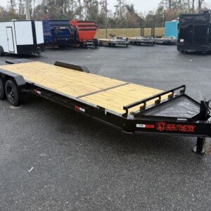 Southern Utility 7x24 tandem axle equipment trailer with spring-loaded ramps, toolbox, black wheels, and treated wood deck.