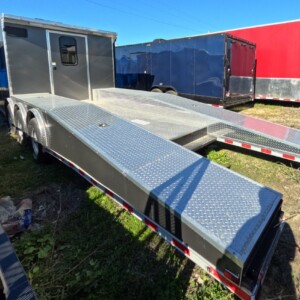 Quality Cargo 8.5x30 hybrid trailer with full bathroom, triple torsion axles, charcoal exterior, awning, and enclosed cargo area.