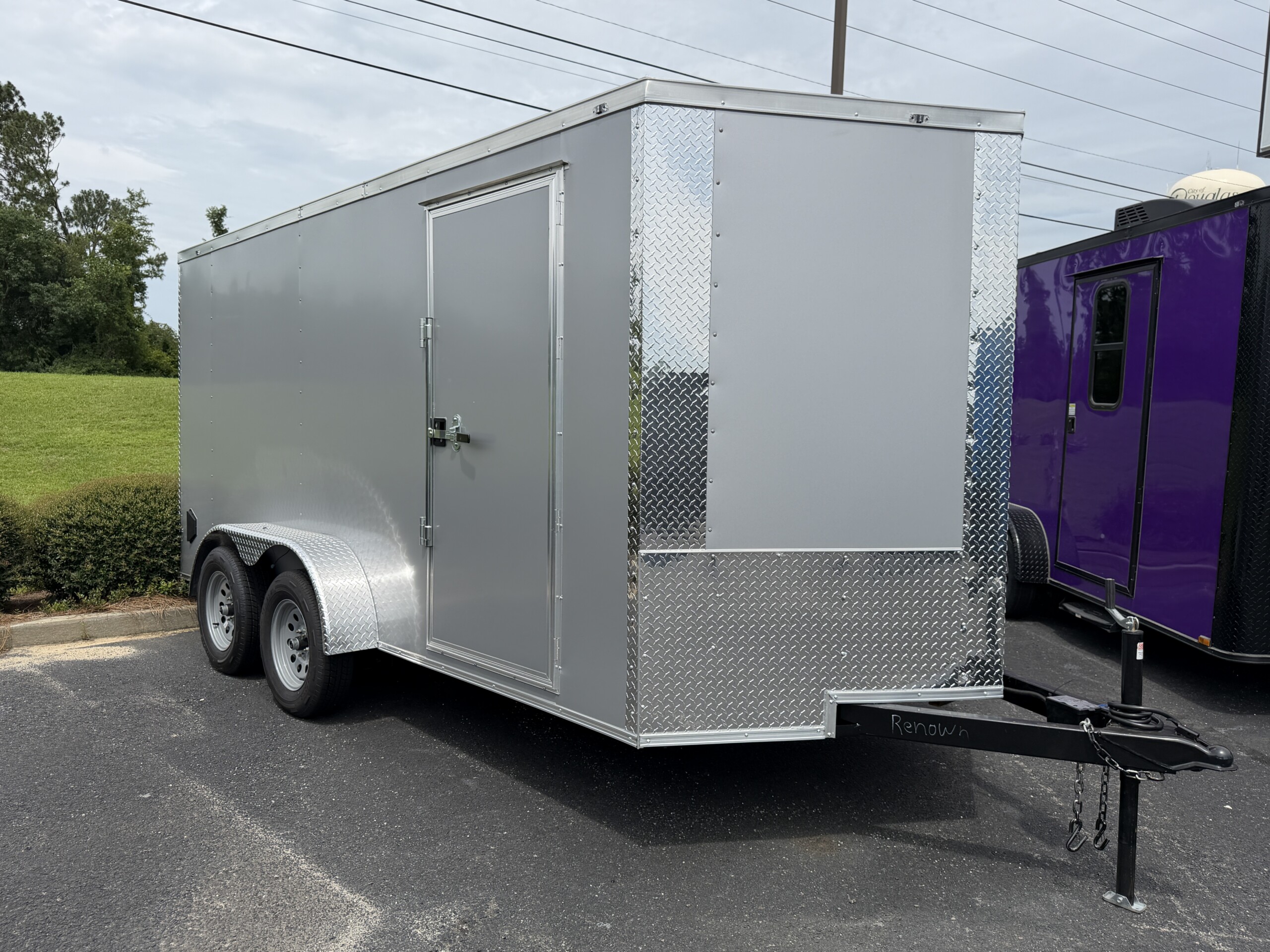 J & C Cargo Trailers 7x14 Silver Frost enclosed cargo trailer with polycore exterior, semi-screwless construction, barlock, and black sidewall vents for sale.