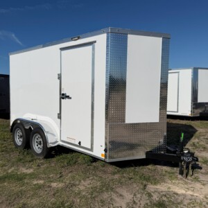 Diamond Cargo 6x12 tandem axle enclosed trailer with 7 foot interior height, Polycore exterior, side door, ramp door, electric brakes, and silver modular wheels.