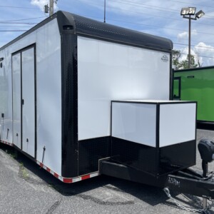 Rock Solid Cargo 8.5x28 enclosed race car trailer with white exterior, blackout package, spread torsion axles, escape door, generator compartment, and premium race trailer package.