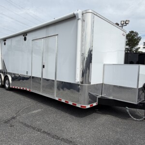 8.5x32 Two-Tone Polycore Tandem Axle Race Trailer with electric awning, recessed winch, and E-Track flooring