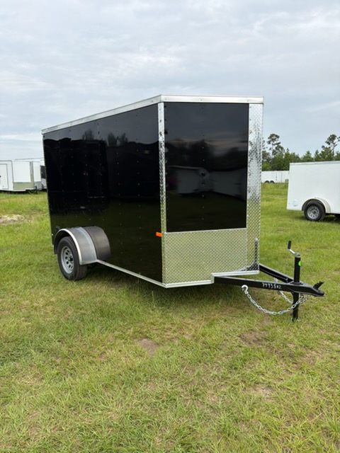 Rock Solid Cargo 6x10 single axle enclosed cargo trailer with Poly exterior, ramp door, V-nose, side vent, and 5-year factory warranty