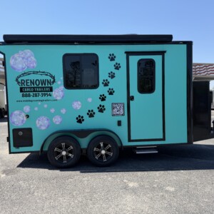 7x14 Legacy Series mobile grooming trailer with Joule Case battery system, Flying Pig tub, electric grooming table, awning, and luxury grooming interior.