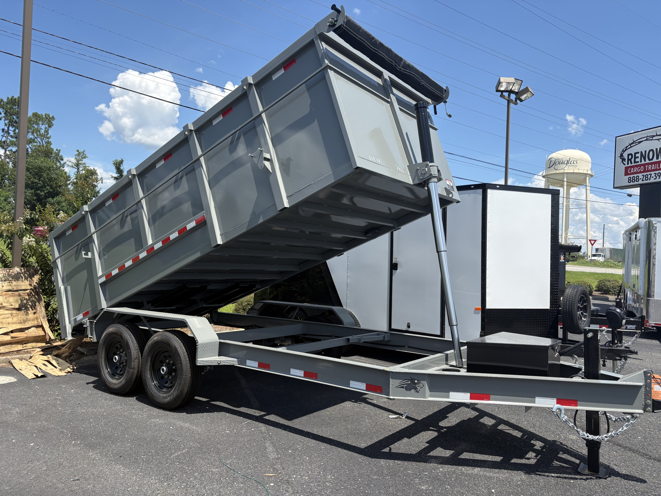 Panther Cargo 7x16x4 dump trailer with 4-foot steel sides and tandem 7K axles