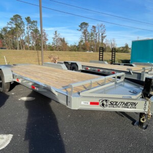 Southern Utility 7x20 tandem axle 14K equipment trailer with heavy-duty I-beam frame, treated wood deck, integrated toolbox and mini pony ramps.