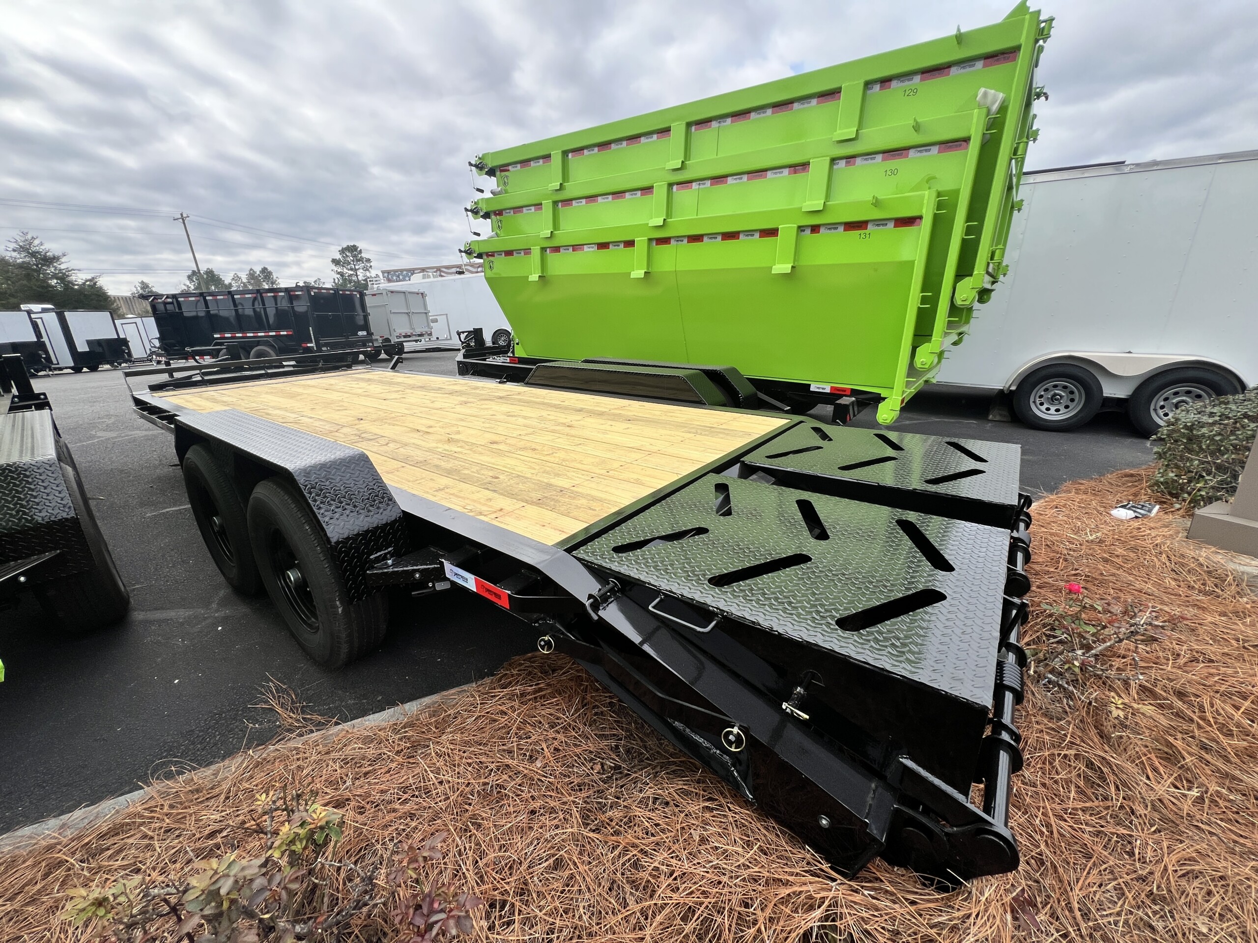 Southern Utility 7x20 tandem axle equipment trailer with 14K GVWR, I-beam frame, treated lumber deck, integrated toolbox and mini pony ramps.