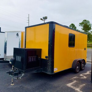 Yellow Genesis Series 7x14 tandem axle mobile dog grooming trailer with blacked-out exterior trim, alloy wheels and extended triple tube tongue.