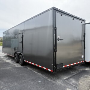 Charcoal gray South Georgia Cargo 8.5x28 enclosed car hauler with blackout exterior trim and alloy wheels.